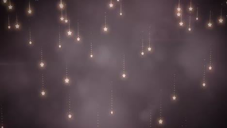 Animation-of-christmas-stars-falling-over-smoke-and-bokeh-lights-on-black-background