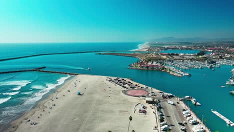 Harbor-in-Oceanside-California-flying-over-the-beach-sand-surf-bike-path-boats-and-marina,-Part-2