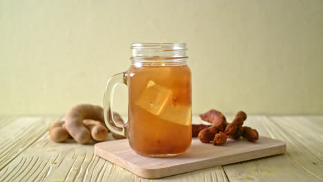 delicious sweet drink tamarind juice and ice cube - healthy drink style