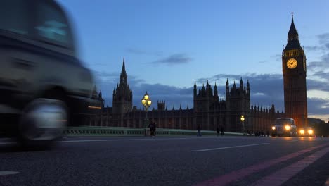 traffic passes in front of big ben and houses of parliament in london england at night 1