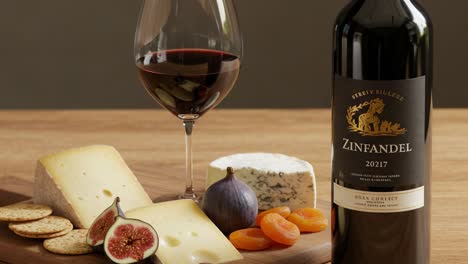 zinfandel wine and cheese board with figs, apricots, and crackers