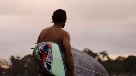 surfer with surfboard at the beach