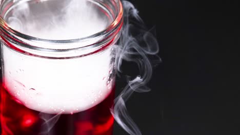 dry ice reacting in a red liquid