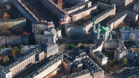 aerial shot of trams passing through saviour square warsaw