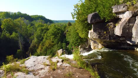 Waterfall-and-majestic-forest-in-Ontario,-Canada,-aerial-view