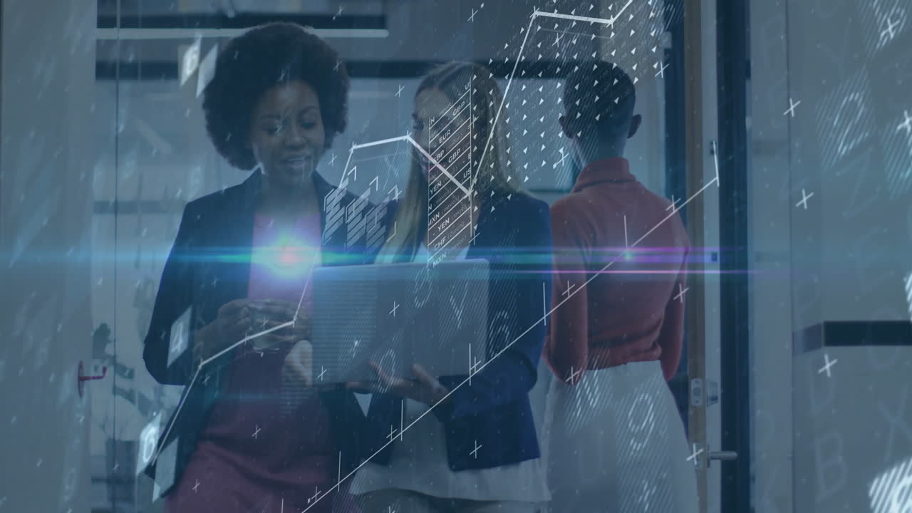 Collaborating with digital data processing animation, businesswomen in office setting