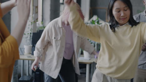 happy team dancing in the office