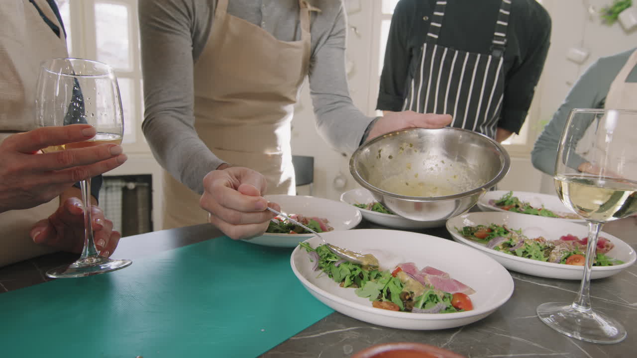 People plating a salad in a cooking class