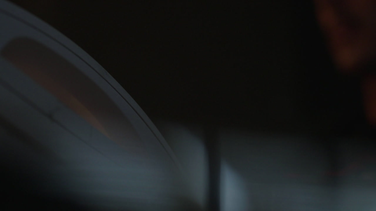 Person Reading a Book at Night