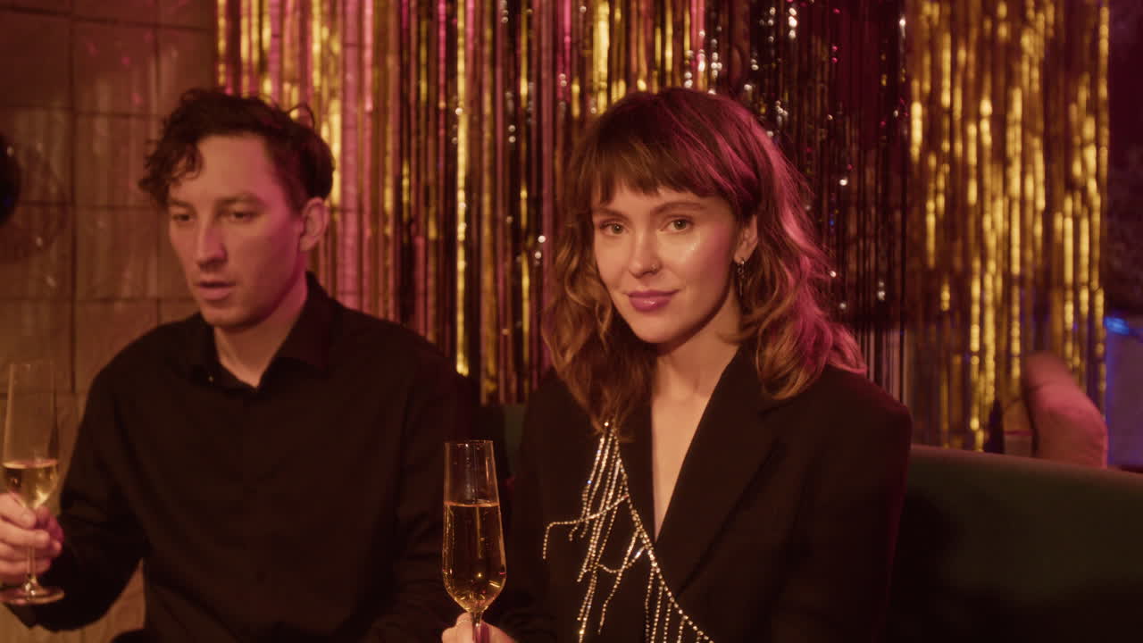 Couple Celebrating with Champagne at a Party