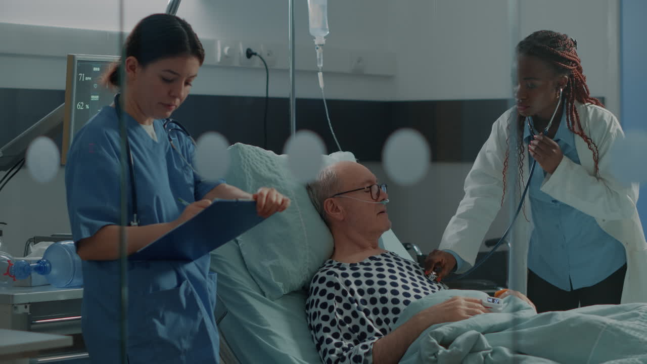 African american surgeon using stethoscope on patient
