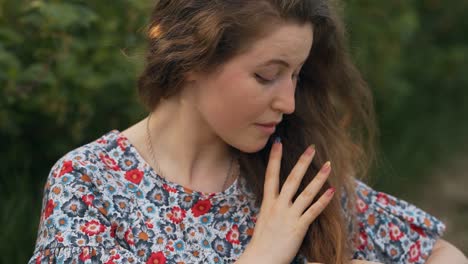 portrait of a beautiful curly red-haired woman