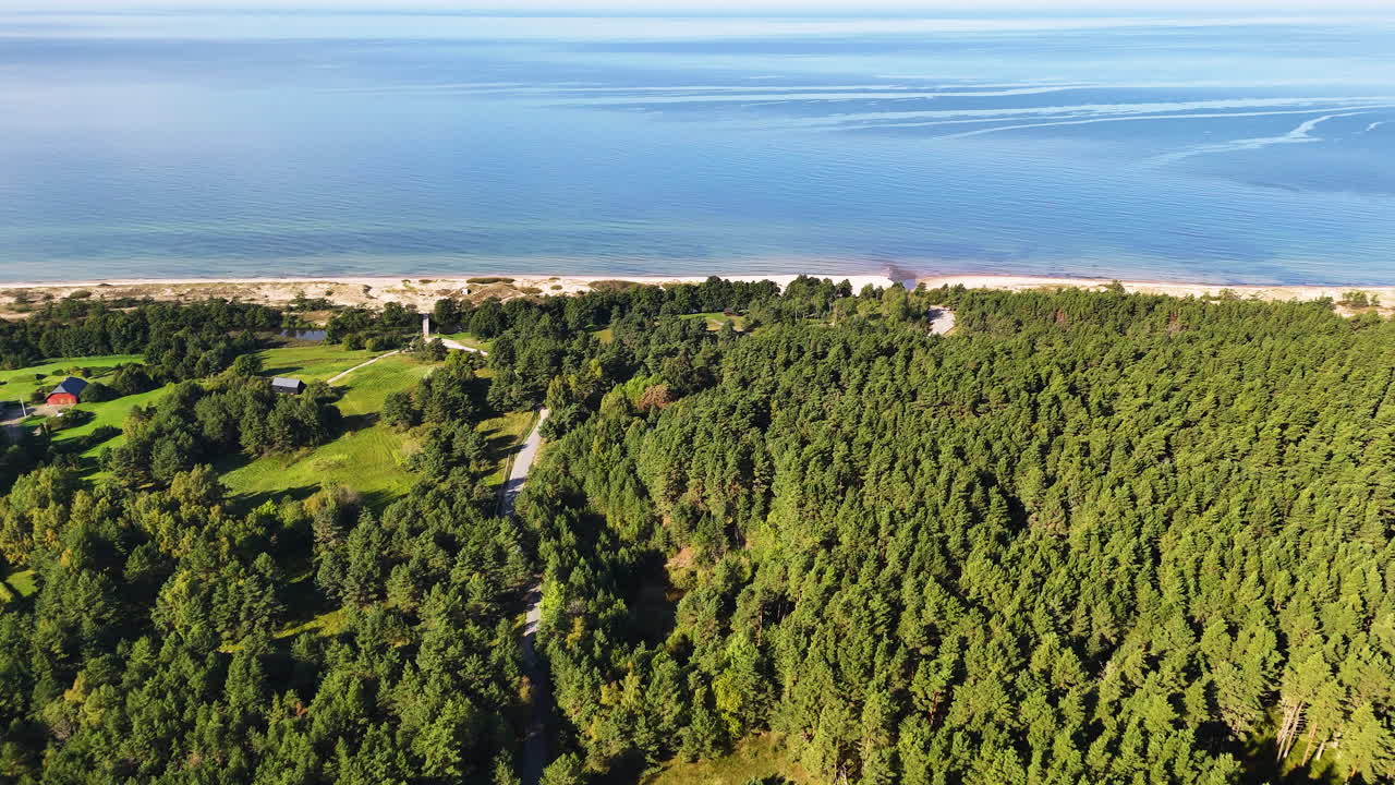 Uzava River Mouth In Latvia. 4K Aerial Approach Towards The Baltic Sea Coast Where The River Meets The Sea.