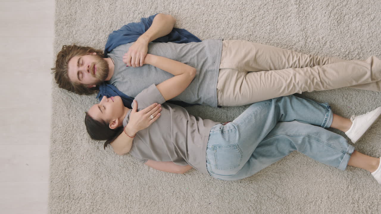 Couple Relaxing on Rug