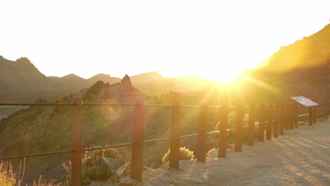 Young-man-admires-sunset-while-exploring-Teide-National-Park,-static-view