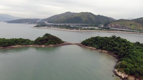 Hong-Kong-bay,-with-a-strip-of-sand-connecting-small-natural-islands,-Aerial-view