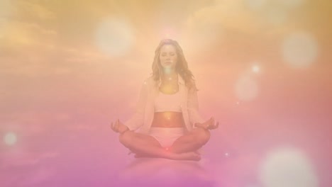 Digitally-generated-video-of-orange-glowing-spots-moving-against-woman-performing-yoga-in-background