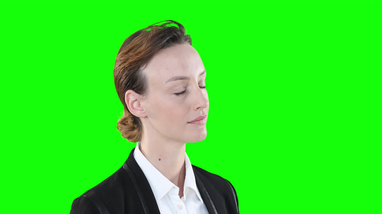 Profile of a Caucasian woman on green background