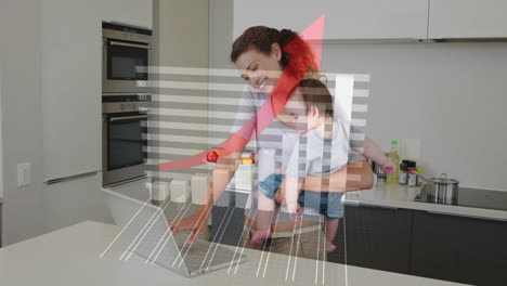 sosteniendo al niño, la madre usando una computadora portátil con animación de gráfico de crecimiento financiero en la cocina