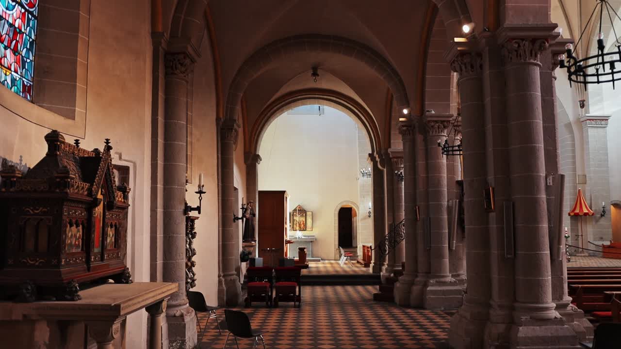 Smooth cinematic point of view walking through the Basilica of St Castor in Koblenz Germany.