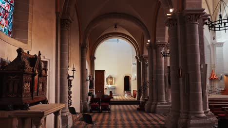 smooth cinematic point of view walking through the basilica of st castor in koblenz germany.