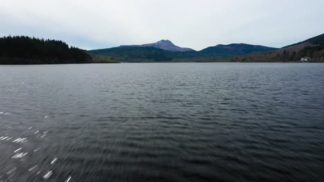 aerial lift up over loch ard water