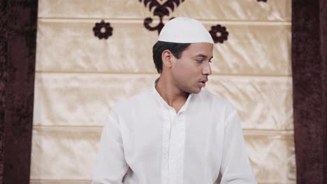 indian man doing sujud prayer at home