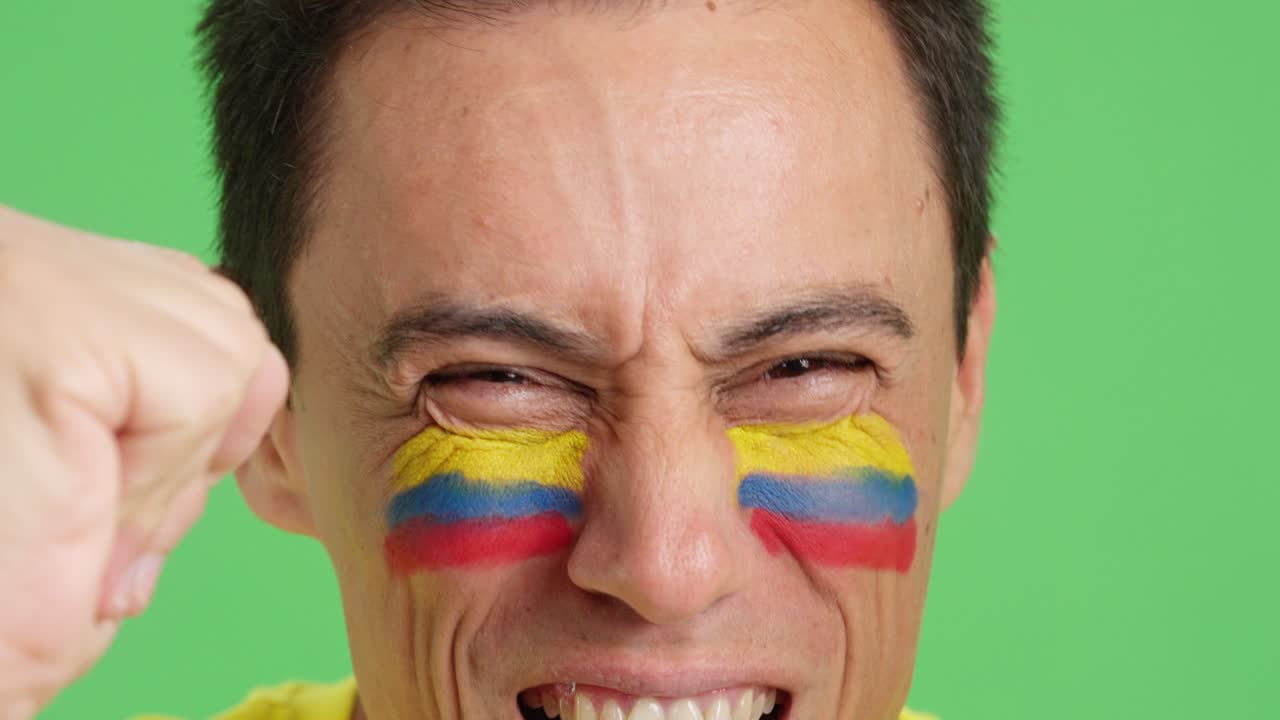 Close up of a man supporting colombian team