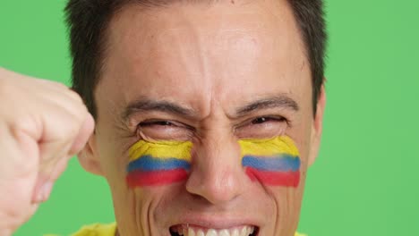 close up of a man supporting colombian team