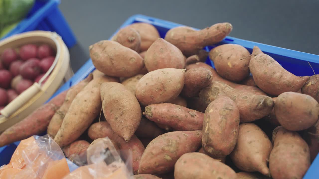 Closeup shot of sweet potatoes in food shelfs in grocery store of Minnesota, USA.