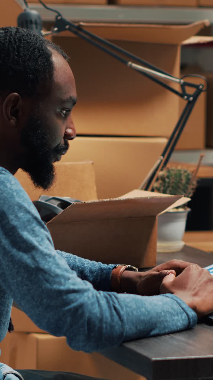Vertical video: African american man analyzing stock and orders