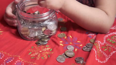 child saving coins