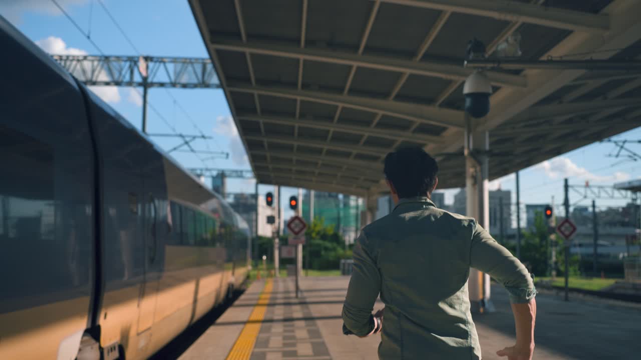 Man Waiting for Train at City Train Station