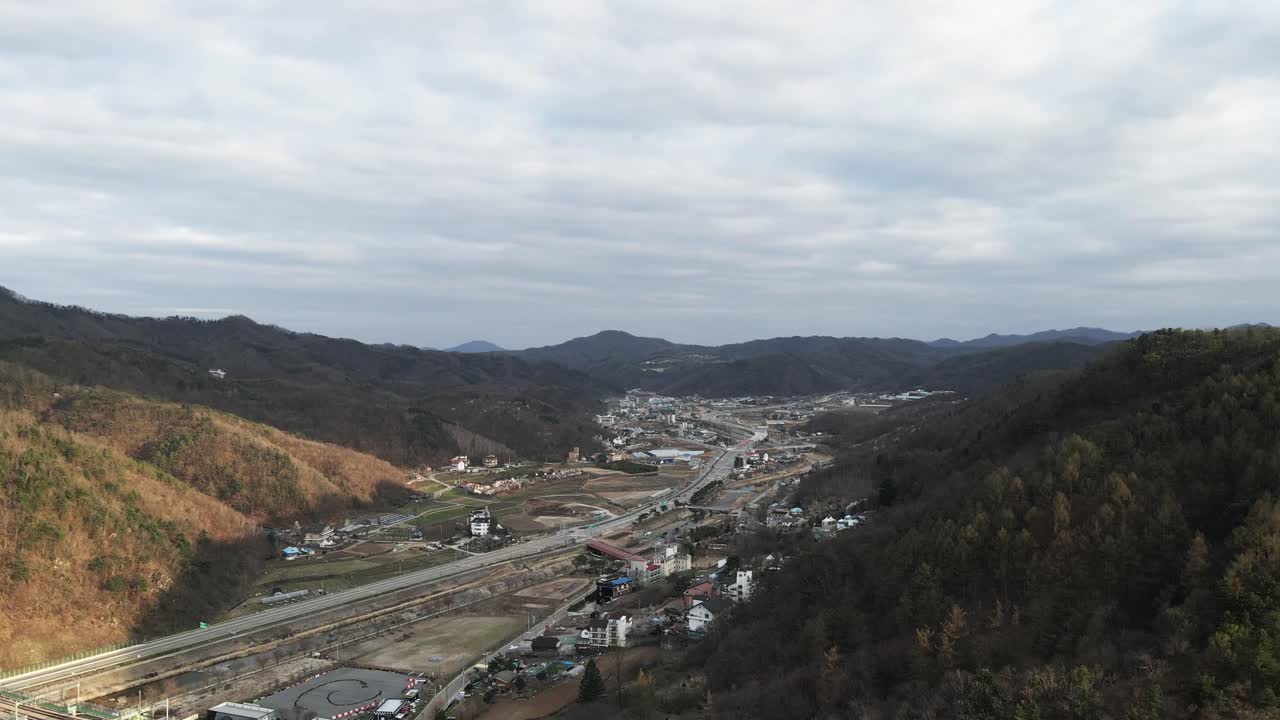 Aerial drone fly over hills and mountains Chuncheon city Gangwon province, South Korea