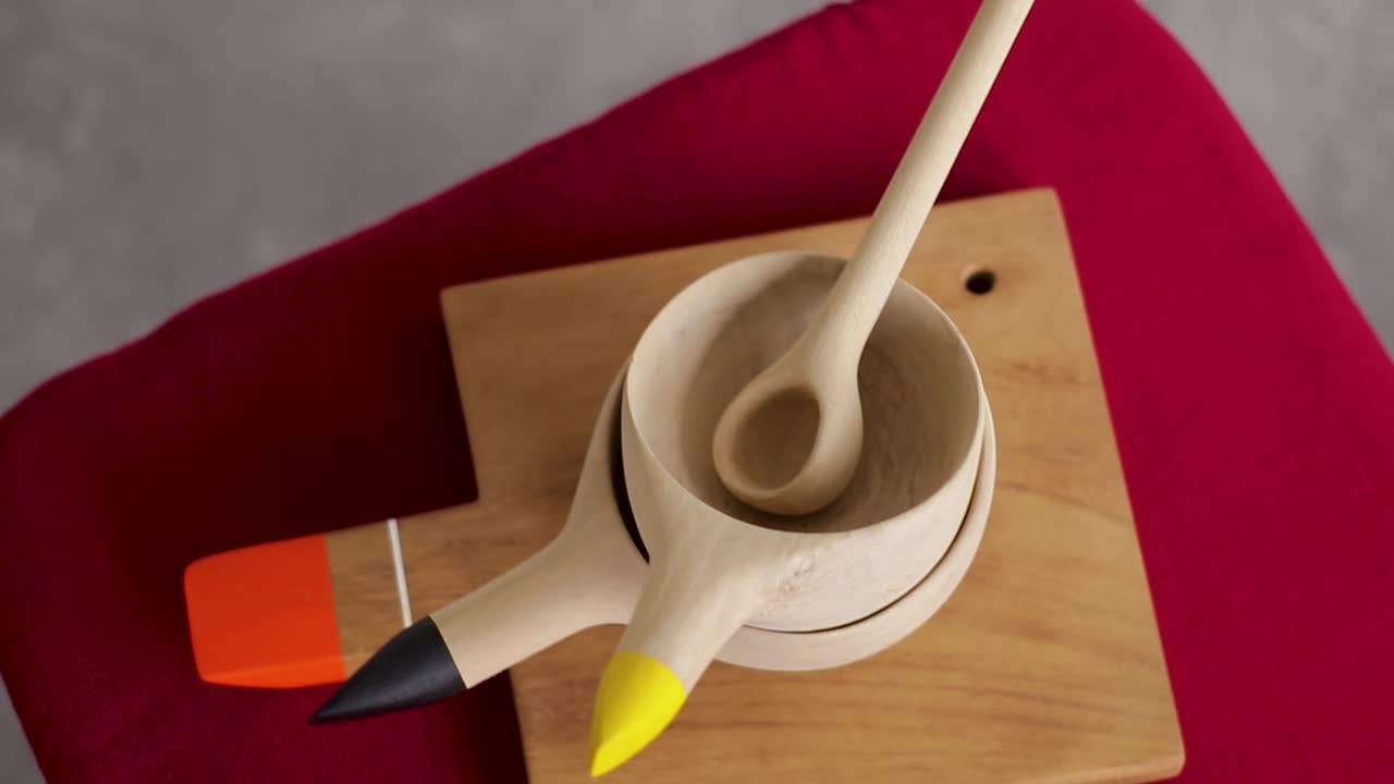 isolated wooden kitchen utensils on a platform