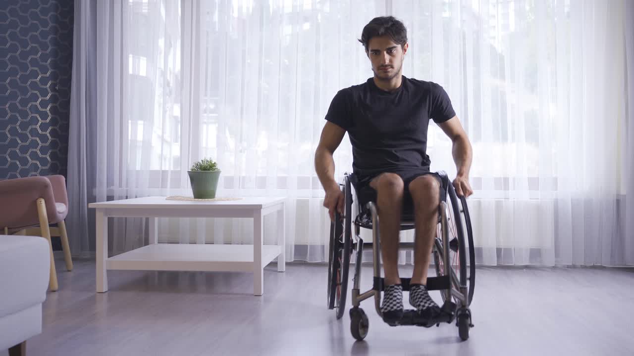 Disabled youth in a wheelchair at home.