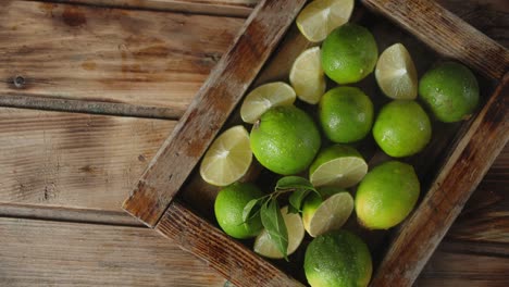 fresh limes on a tray with cool steam.