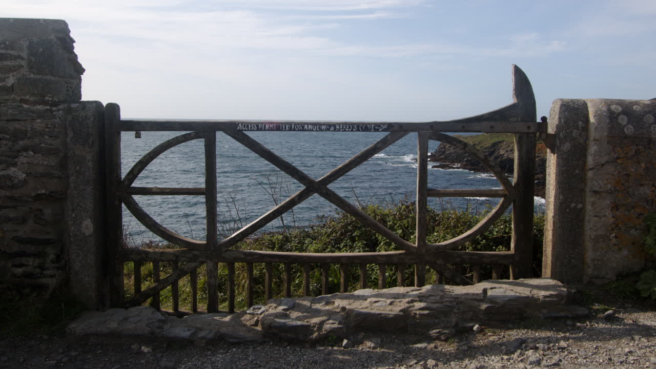 wide shot of an ornate wooden gate at Bessy's Cove, The Enys