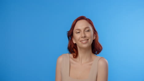 woman with red hair smiling