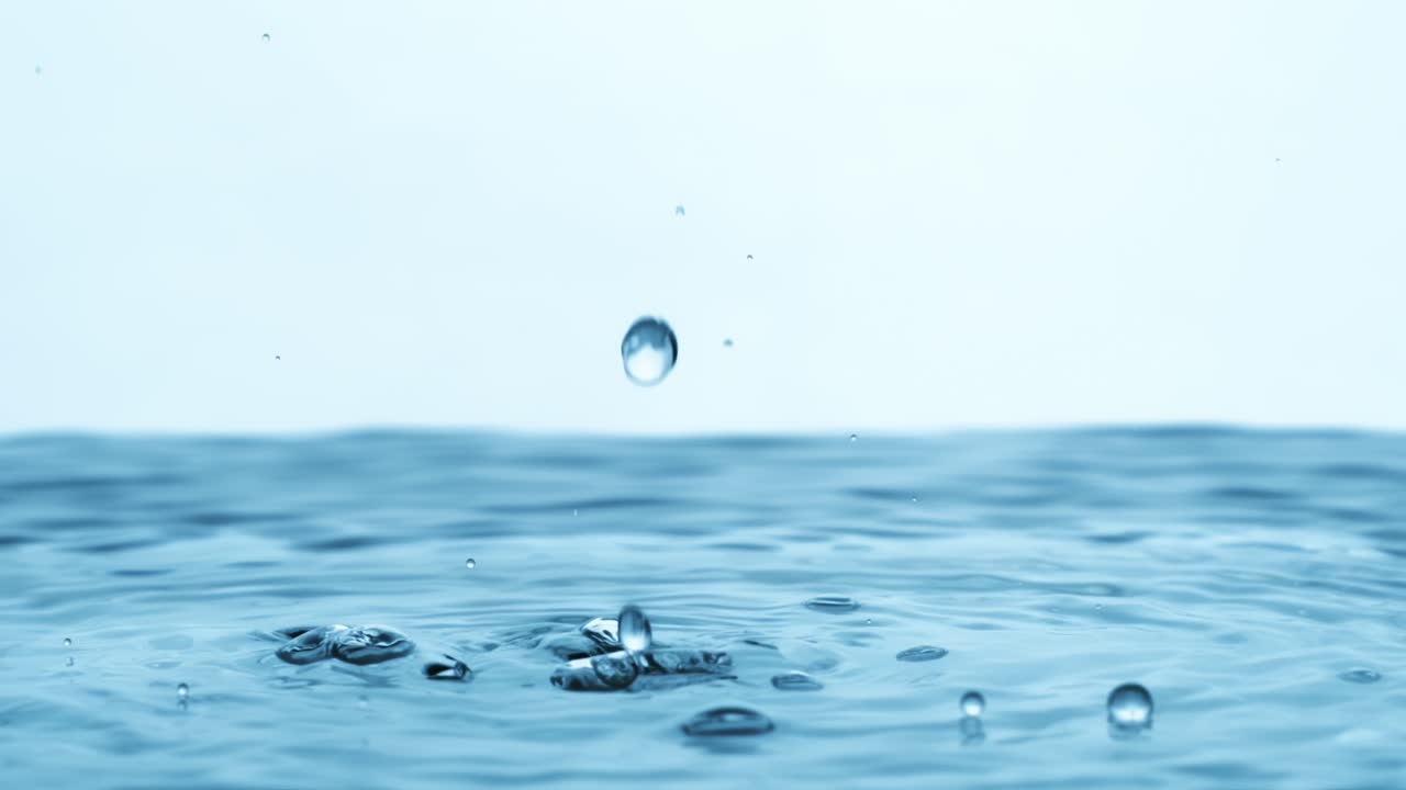 Water Drops close-up of water falls in a super slow motion. Shot on super slow motion camera 1600 fps