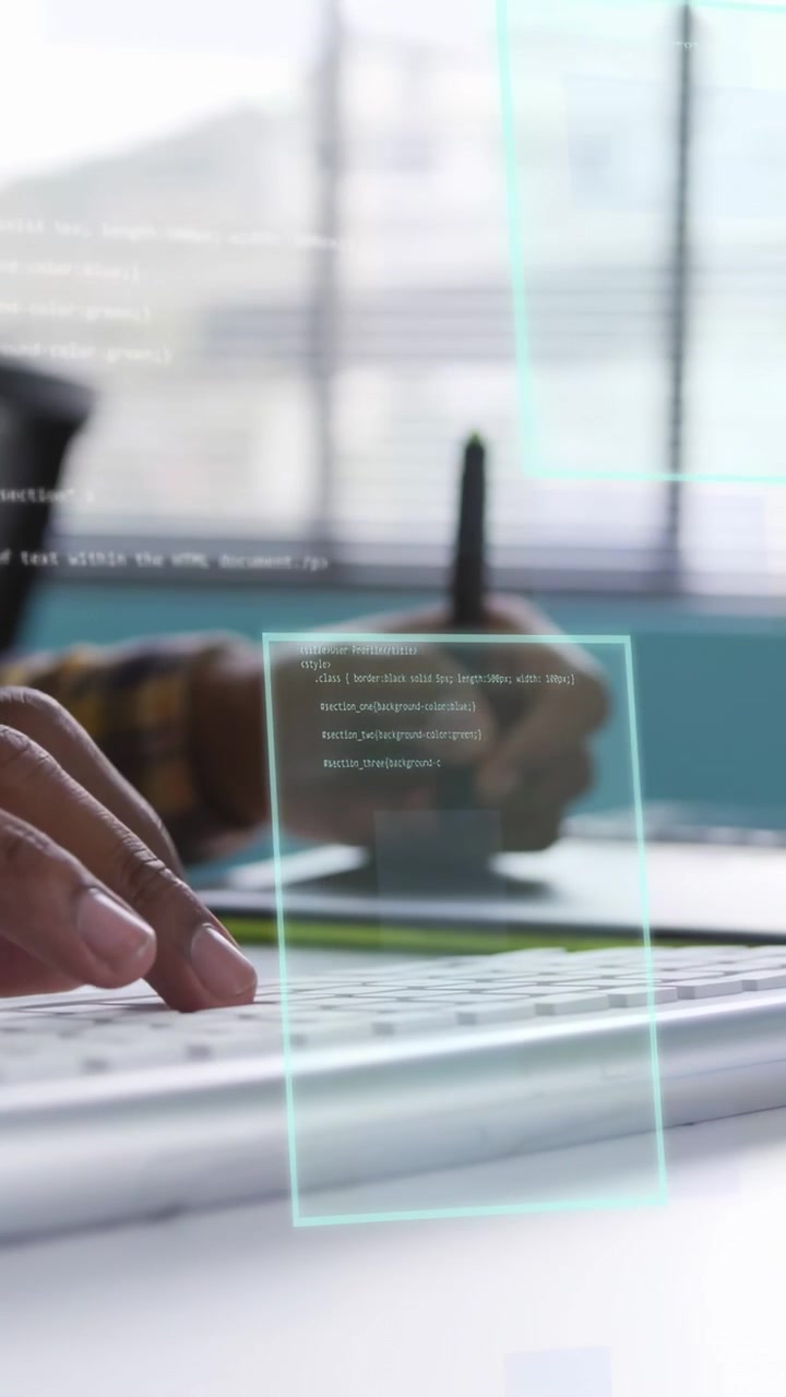 Vertical video: Designer starting editing with stylus on tablet while typing, HUD overlay animating