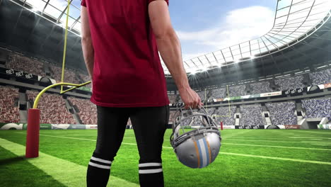 jugador de rugby masculino contra el estadio en el fondo