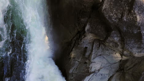 vertical footage of god's bath waterfall during a clear, sunny day