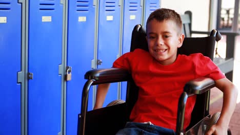 Portrait-of-handicapped-schoolboy-sitting-on-wheelchair-4k