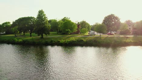 superb-aerial-above-lake-Big-Bear-Lake-in-Century-Park-from-Vernon-Hills-Illinois-USA-while-bird-enters-frame