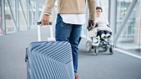 walking, back and hands on luggage in airport to