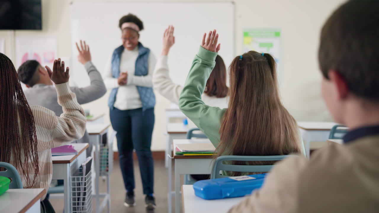 Students Raising Hands in Classroom