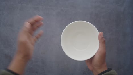 empty bowl held in hands
