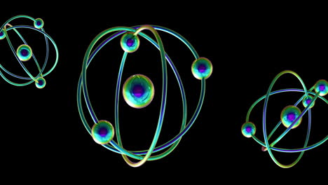 animación de modelos de átomos que giran sobre un fondo negro
