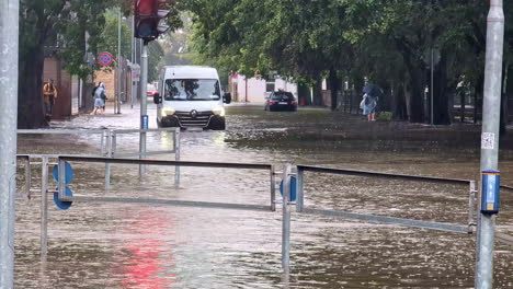 flooded street in a city with rainy weather on slowmotion